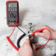 Picture showing how to use a multimeter to check continuity between terminals on a headlight switch